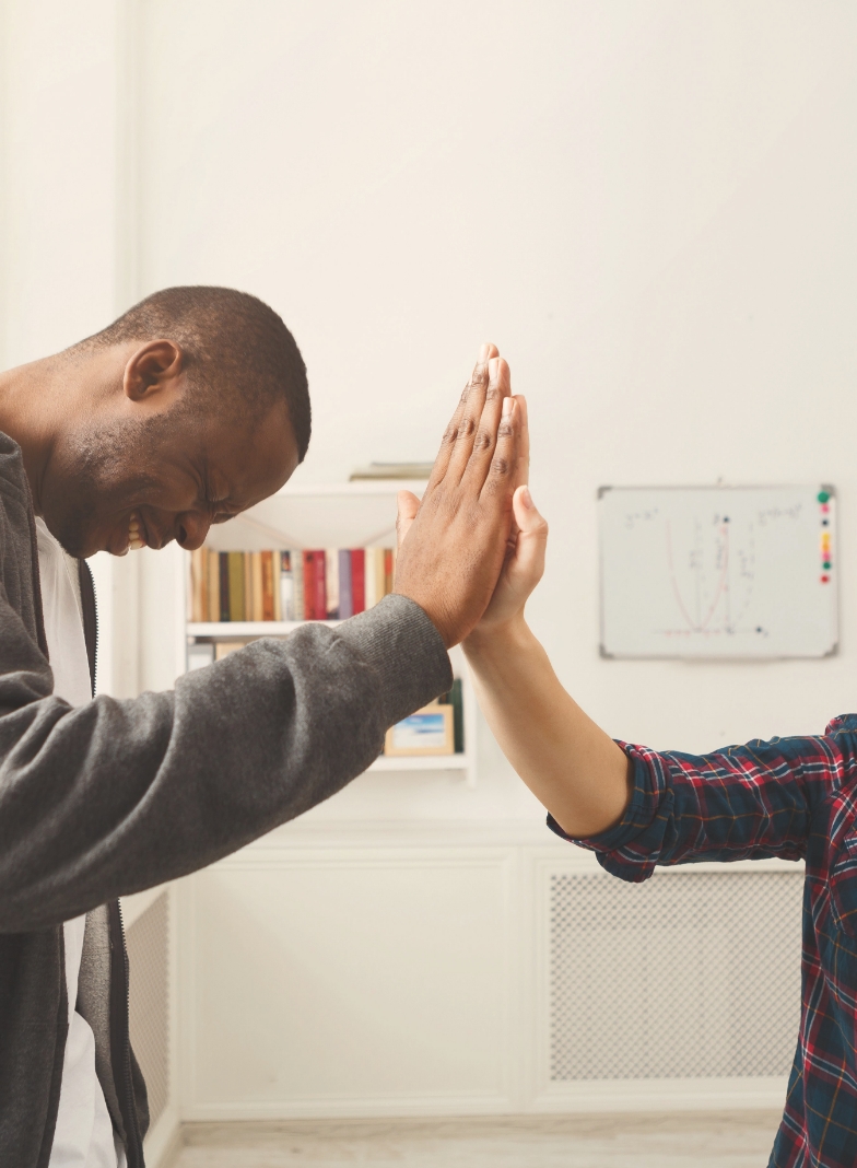 two people high-fiving