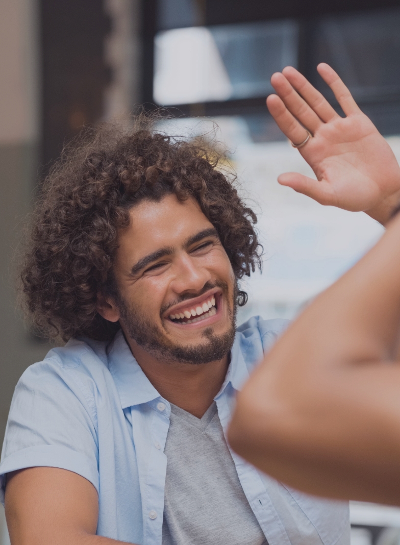 two people high-fiving